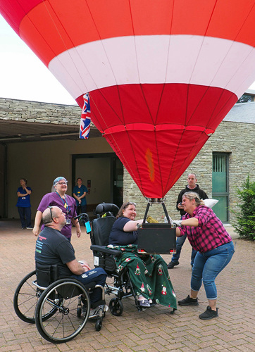 Katie operating the balloon watched by patients and staff