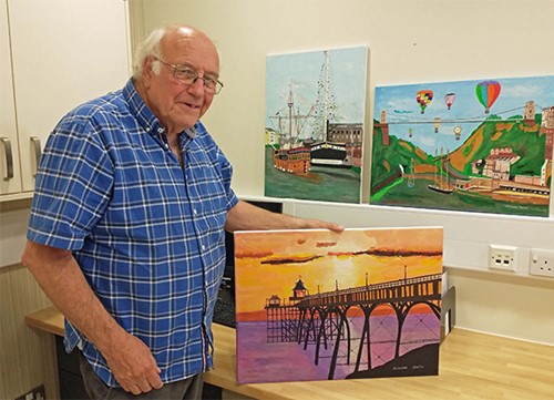 Richard with his paintings