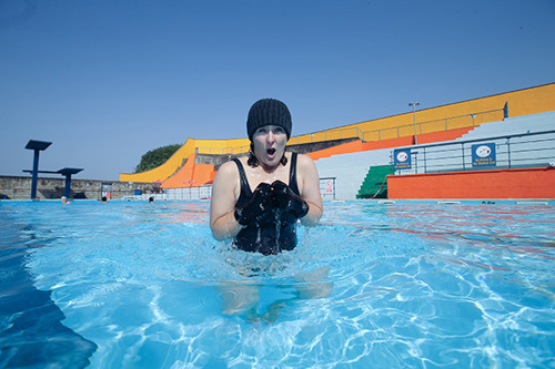 Woman shivering in a cold pool