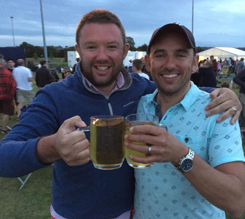 Mark and David enjoying a beer at a festival